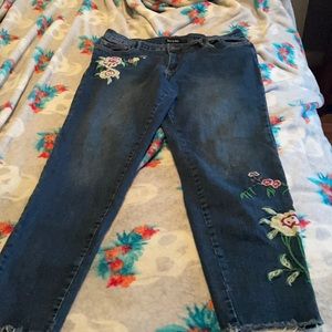 Embroidery around lower leg and side pocket